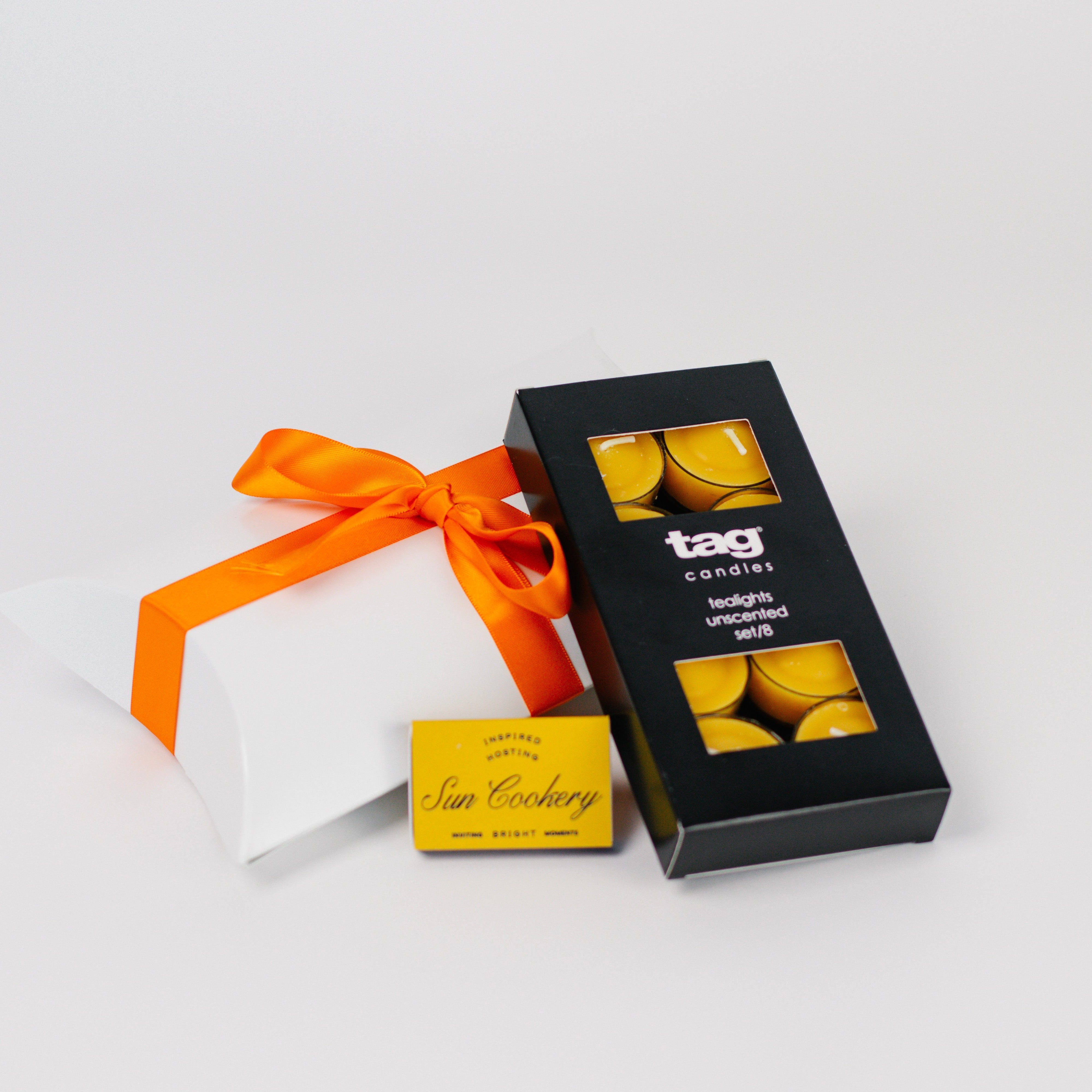 Set of 8 unscented golden tealights with matches